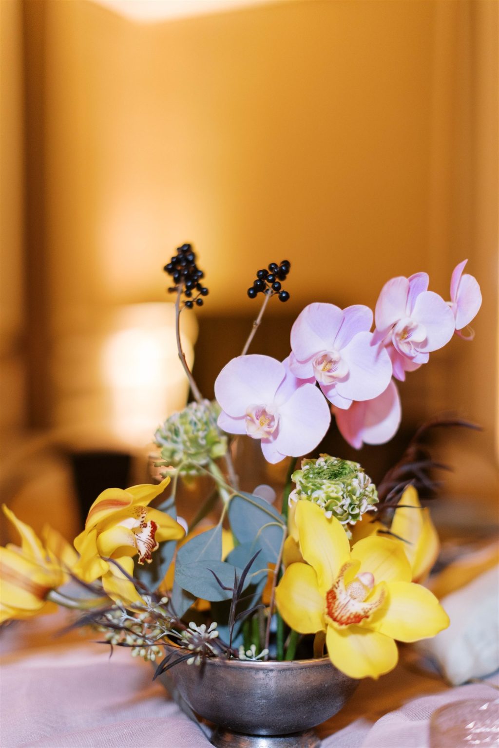 WIPA Colorado Gala in Aspen: a pink and yellow orchid centerpiece
